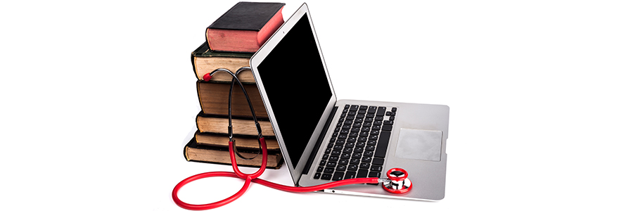 stethoscope, laptop and books